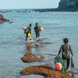 A group of Haenyeo get ready for a dive near Songsan Ilchulbong on Jeju Island, South Korea.
