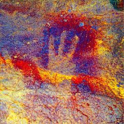 modified photograph of handprints made by neanderthals in Maltravieso cave