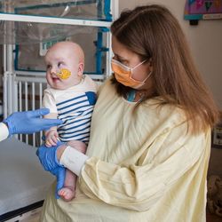 Drs. Kiran Musunuru and Rebecca Ahrens-Nicklas with patient KJ.