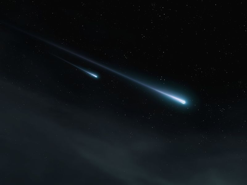 Two meteor trails against the background of stars at night