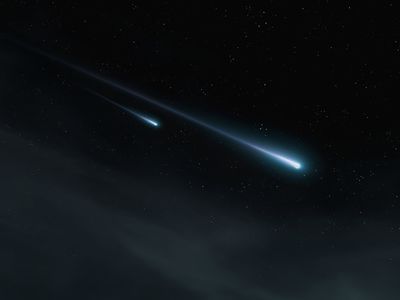 Two meteor trails against the background of stars at night
