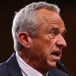 Robert F Kennedy Jr speaking into a microphone (left); close-up of a gloved hand holding a vial of the measles, mumps, and rubella (MMR) vaccine (right)