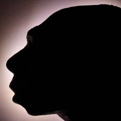  Neanderthal head in a silhouette profile.
