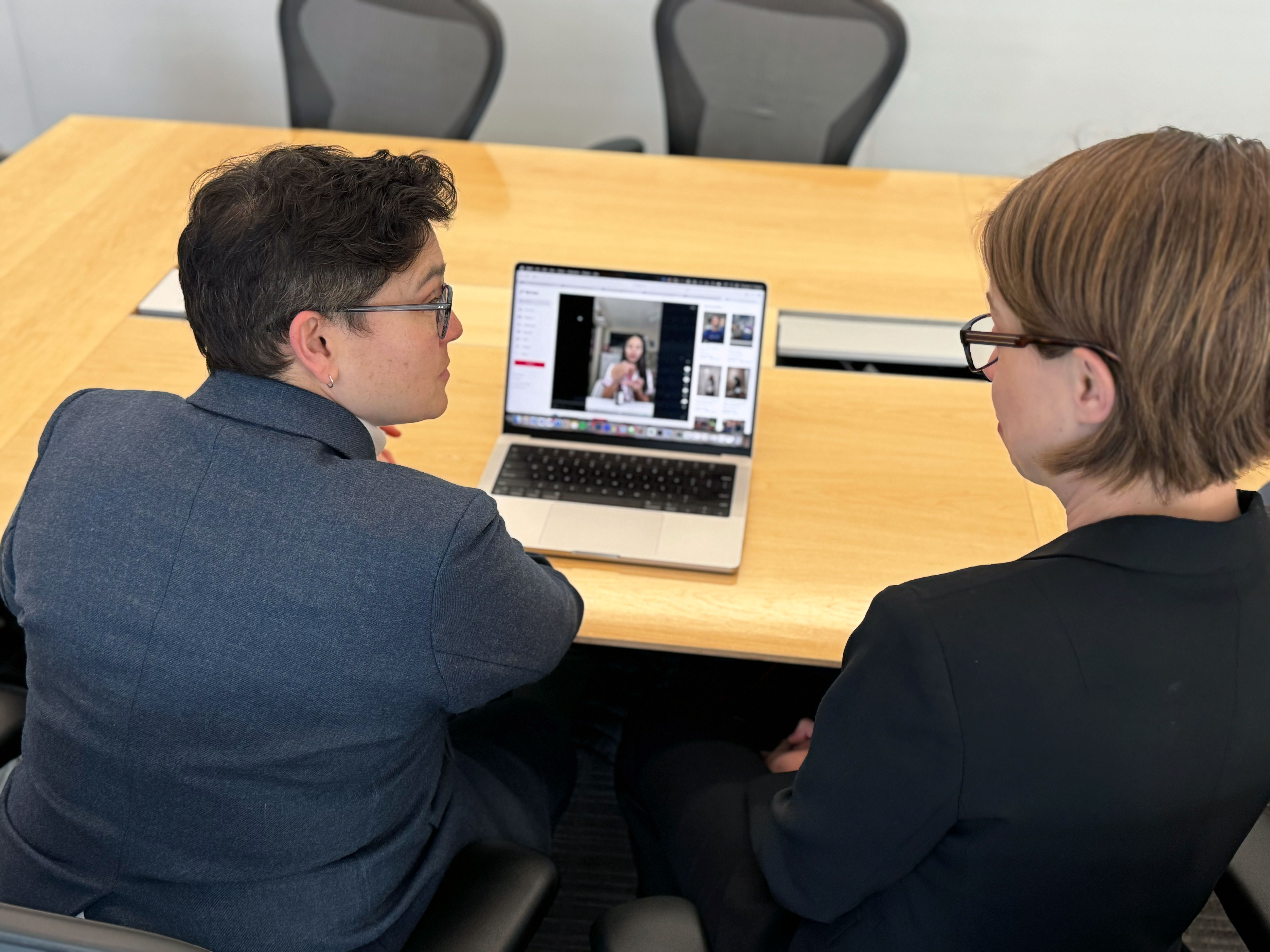 Senior author Dr. Tara Lagu (left) and corresponding author Dr. Molly Hales (right) review a TikTok video from the study.
