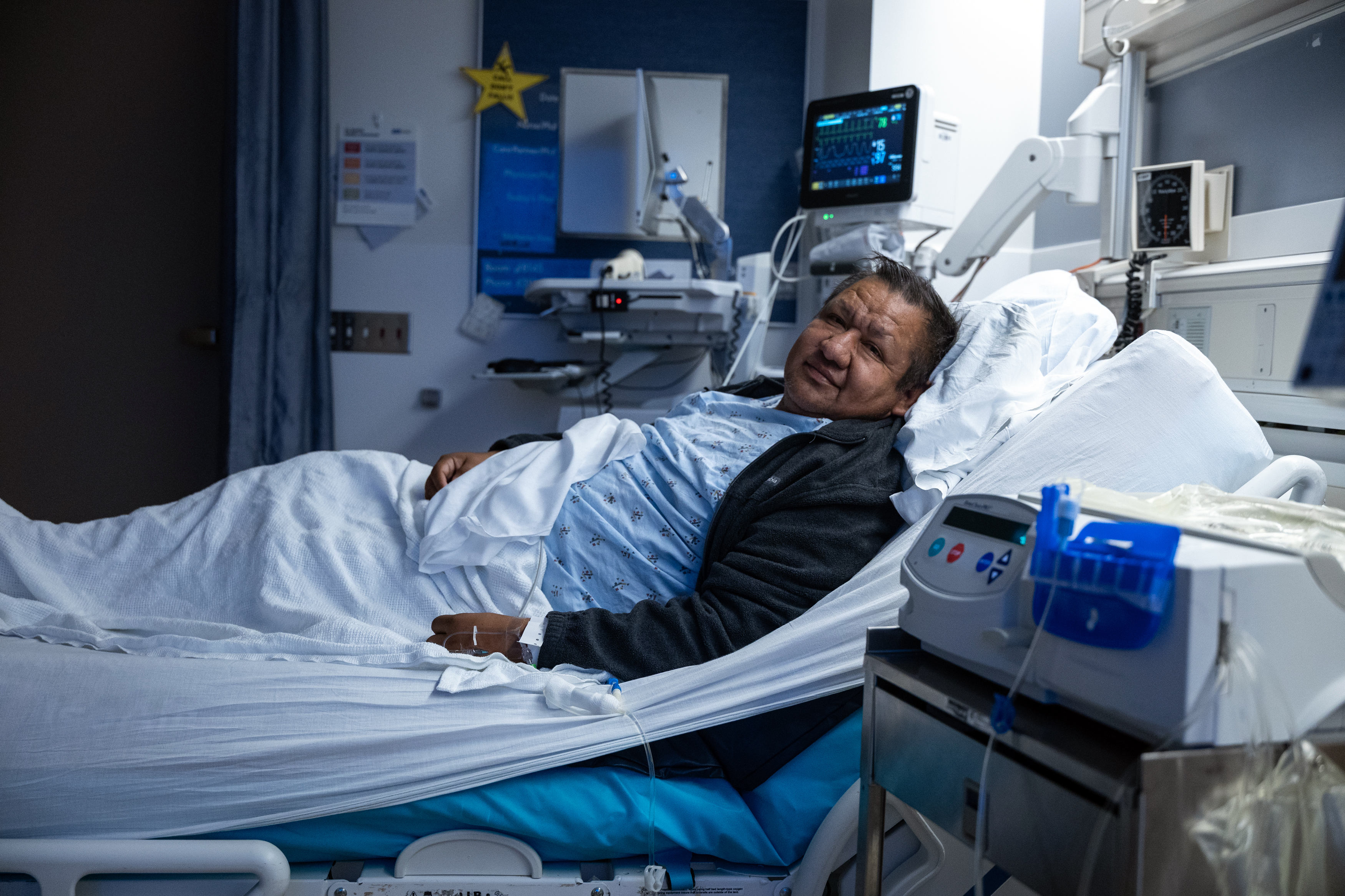 Recipient of the world's first human bladder transplant lying in a hospital bed