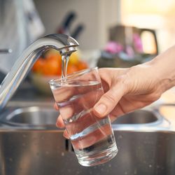 Pouring Fresh Tap Water Into a Glass