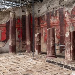 Red painting frescoes at the Roman city of Pompeii