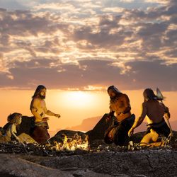 3d render illustration of Prehistoric cavemen by the campfire 