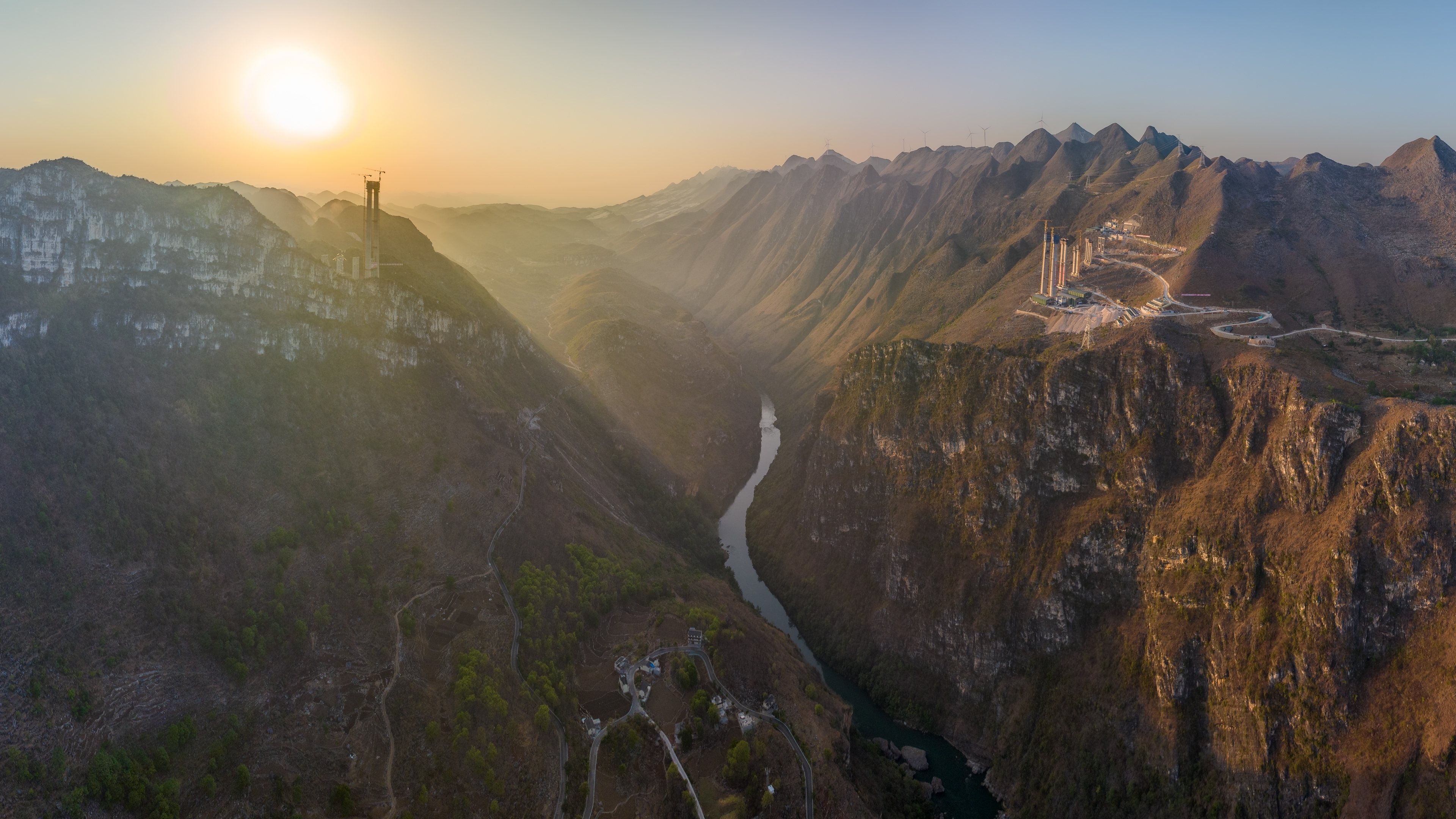 Aerial view of the Huajiang Grand Canyon at the border of Zhenfeng County and Guanling County in Guizhou, where the highest bridge is being built Aerial view of the Huajiang Grand Canyon at the border of Zhenfeng County and Guanling County in Guizhou, where the highest bridge is being built