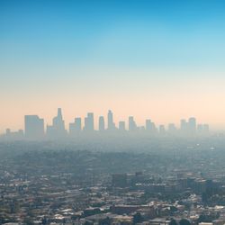 smog over downtown skyscraper buildings and suburbs of Los Angeles from Griffith Park California