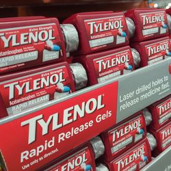 bottles of tylenol rapid release gel capsules on a supermarket shelf