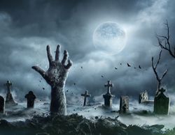 Undead zombie hand rising out of a grave