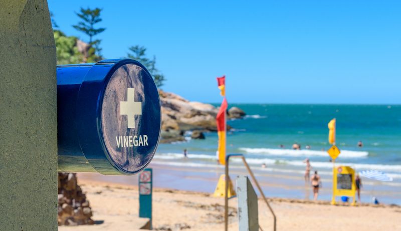 A vinegar station on the beach for treating a marine stinger or jellyfish sting at Alma Beach, Magnetic Island, Queensland, Australia