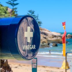 A vinegar station on the beach for treating a marine stinger or jellyfish sting at Alma Beach, Magnetic Island, Queensland, Australia