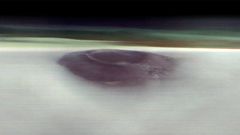Arsia Mons poking through the Martian clouds.