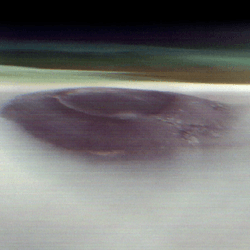 Arsia Mons poking through the Martian clouds.