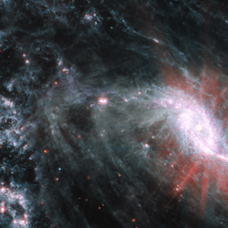 a spiral galaxy seen by jwst. the wispy gas present in the arms of the spiral is clearly seen in this image