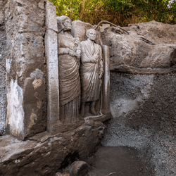 Reliefs of a life-sized married couple at tomb in Pompeii