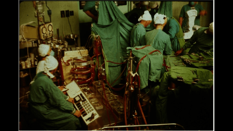 team of scientists doing open heart surgery in 1960s